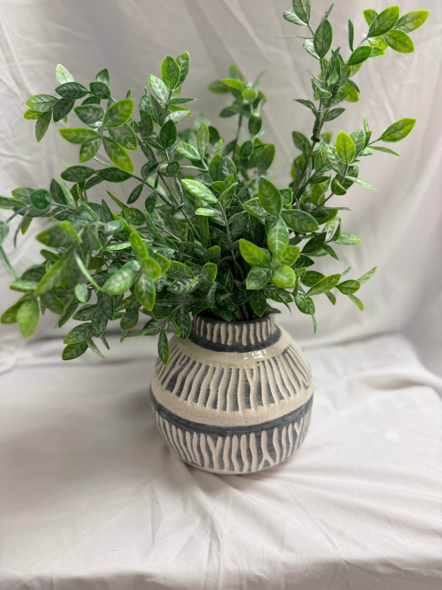 FAUX PLANT IN BLUE AND WHITE VASE